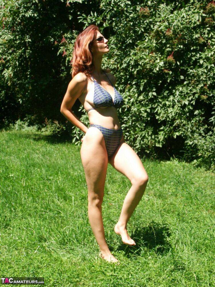 Hot redhead amateur Vanessa disrobes under a tree to air her big saggy tits - #15