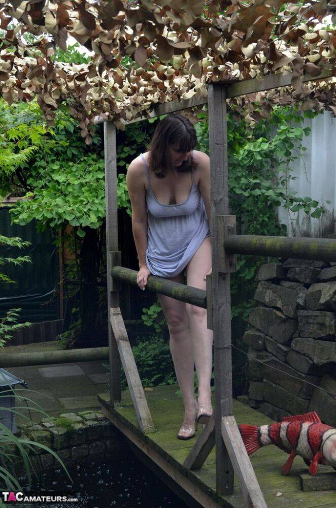 Amateur woman Hot MILF gets totally naked on a footbridge in the backyard - #1