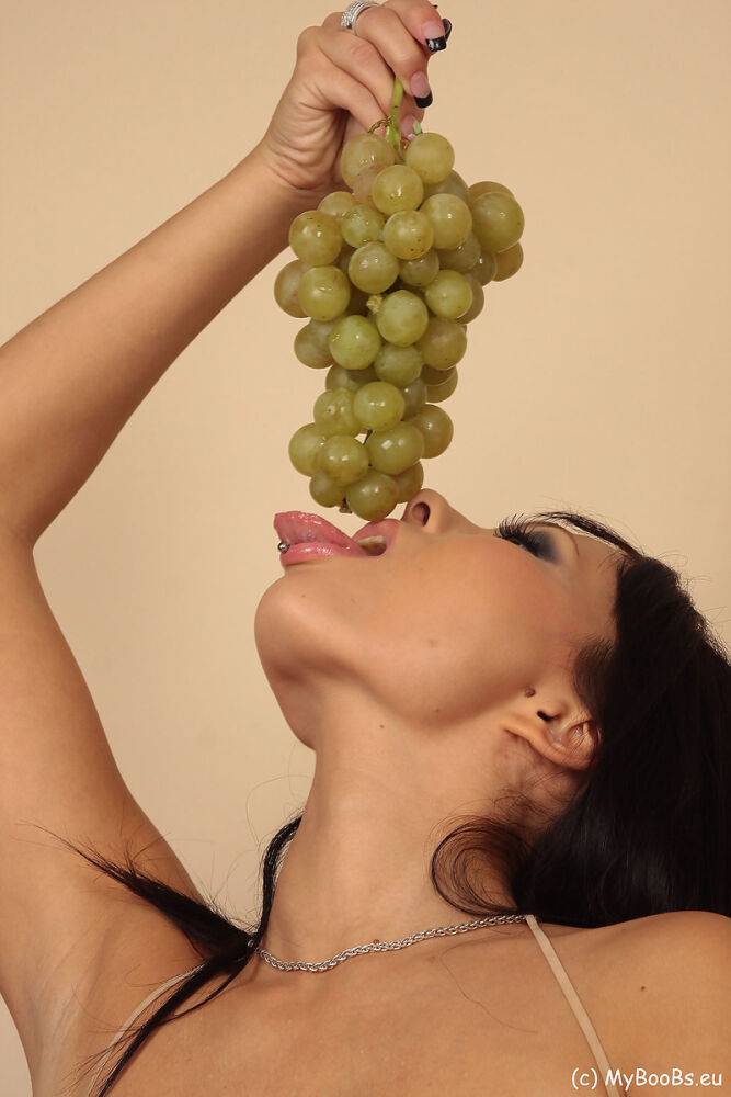 Hot brunette Domino strips to hosiery and boots while eating a bunch of grapes - #3