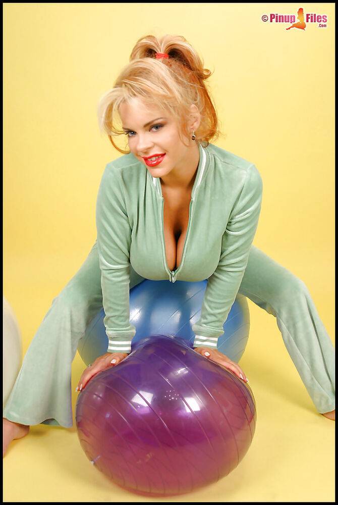 Busty babe denudes her huge round tits and poses with a fitness ball - #2