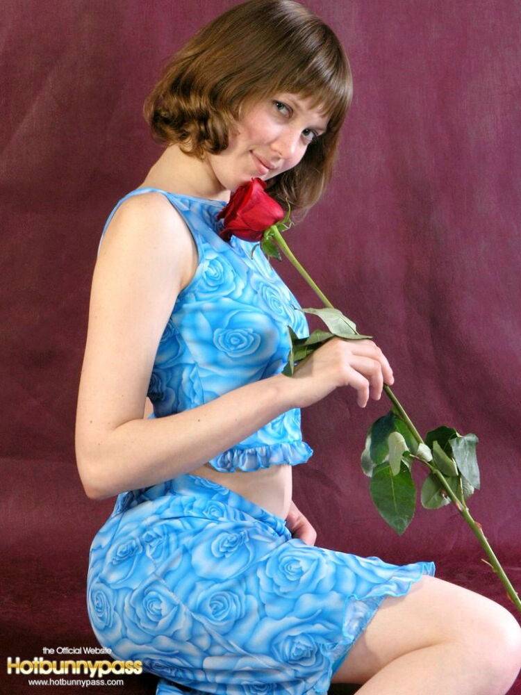 Adorable teen Anabell sniffs a red rose before taking off her clothes - #13