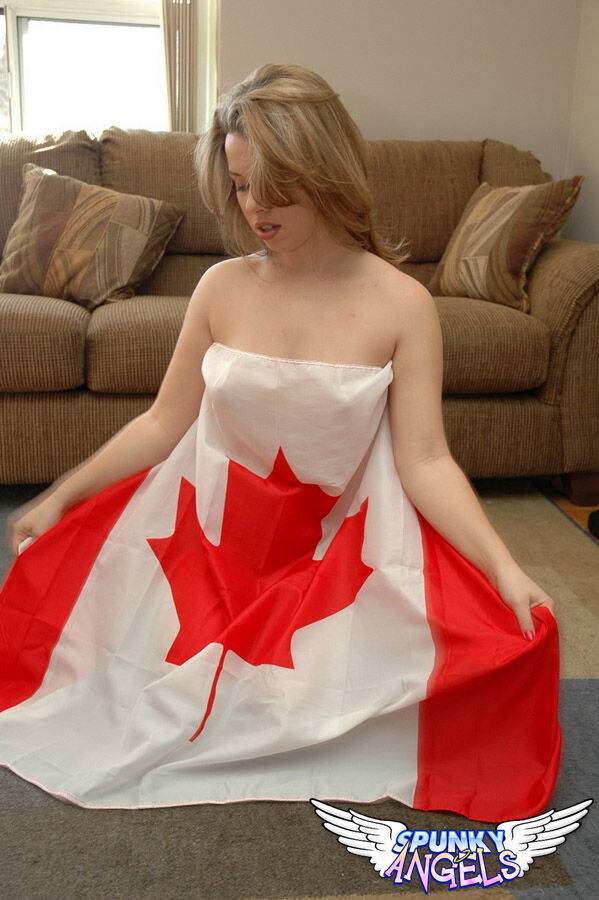 Naked teen Kerie Hart wraps herself in a Canadian flag during sfw action - #12