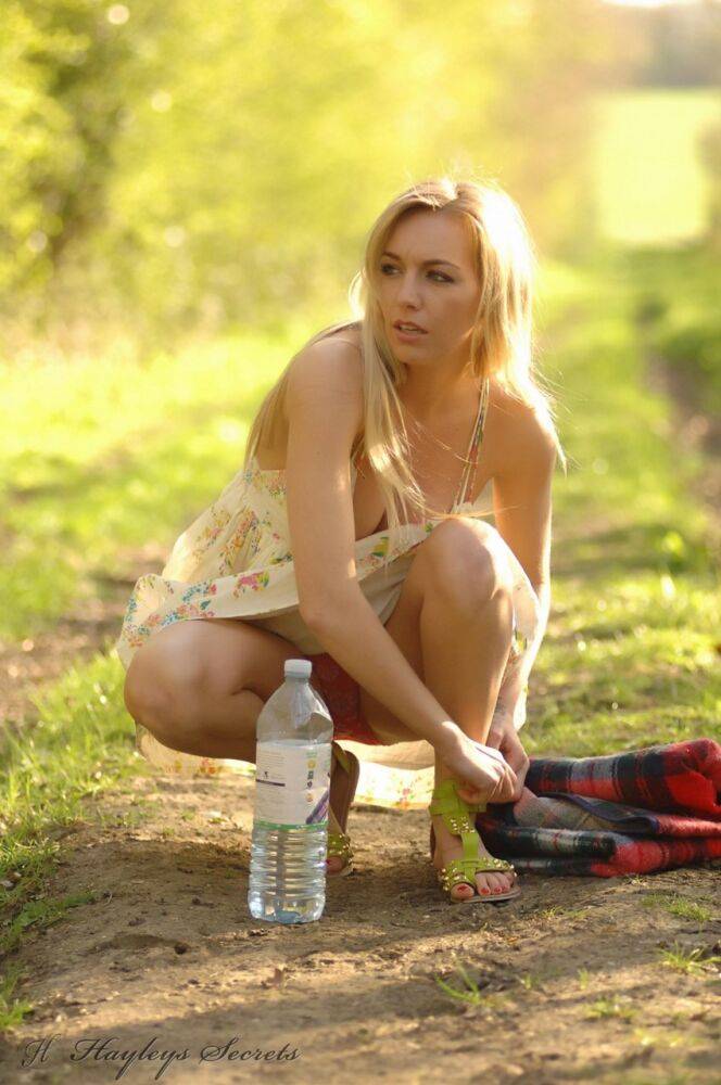 Blonde amateur Hayley Marie Coppin strips naked on a blanket in the woods - #10
