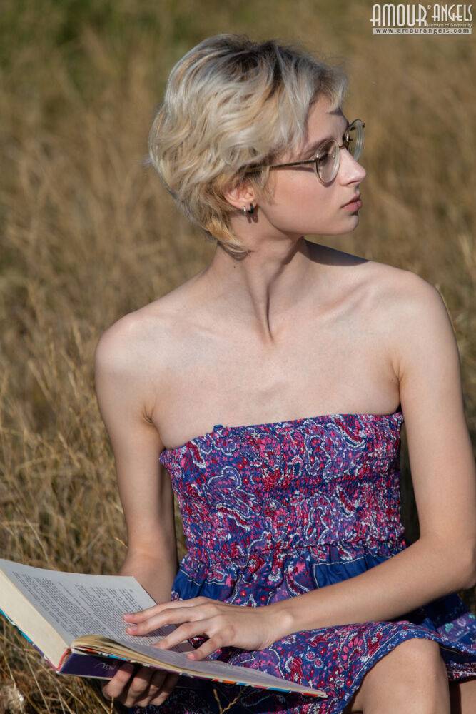 Nerdy female ditches her book and glasses before getting naked in a field - #12