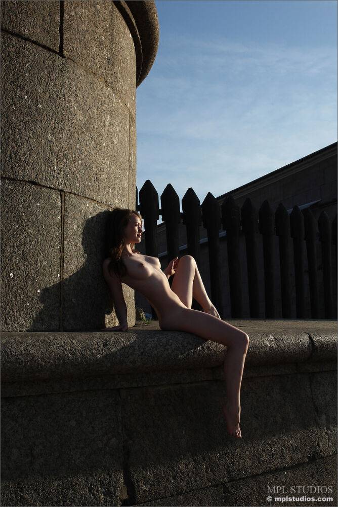 Totally naked girl strikes great solo poses while in a public place - #5