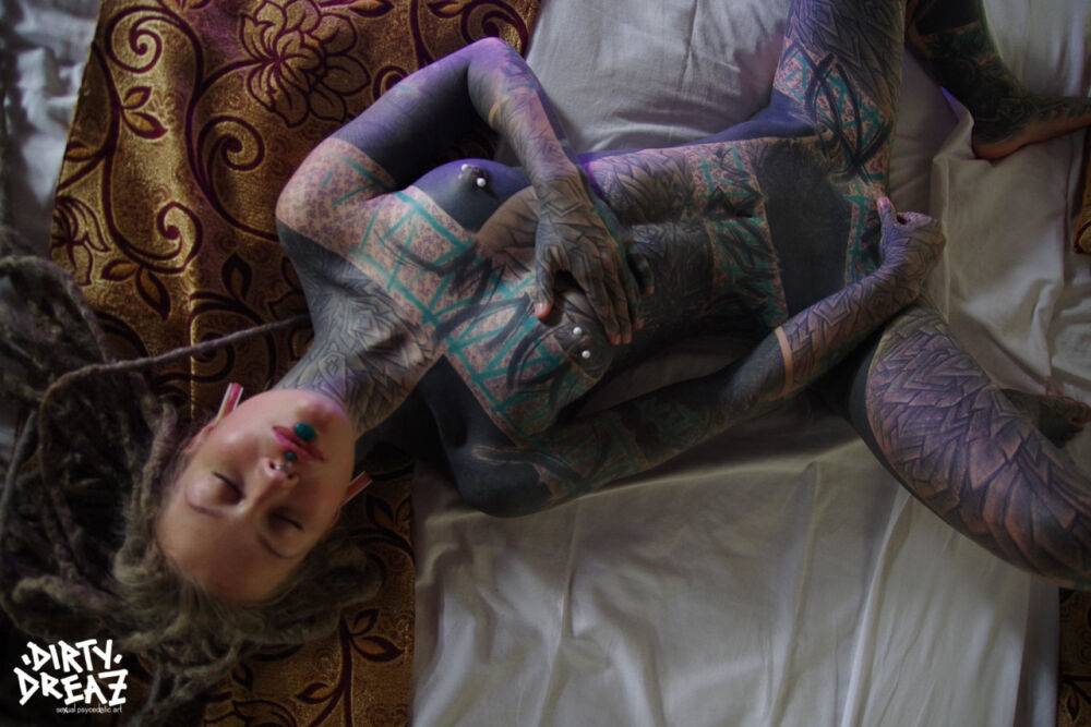 Heavily tattooed woman gives a blowjob while fondling pierced nipples - #7