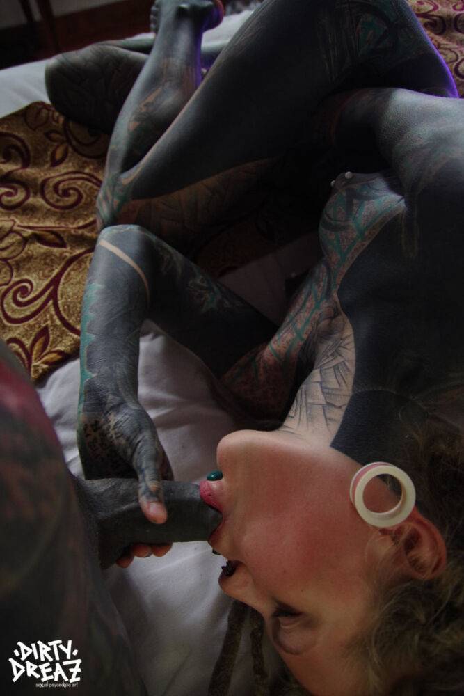 Heavily tattooed woman gives a blowjob while fondling pierced nipples - #2