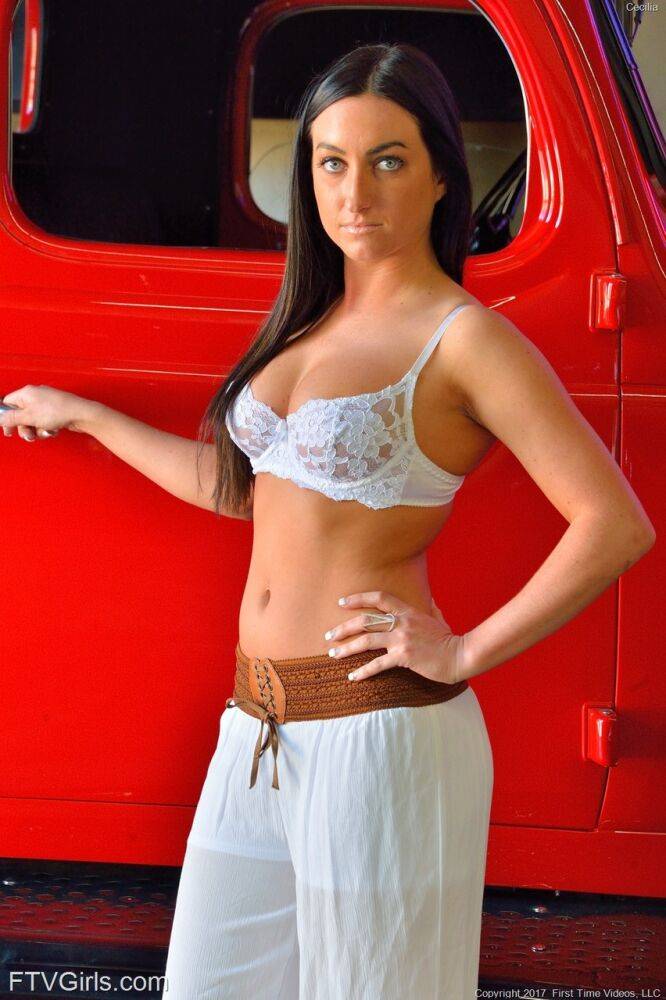 Dark haired girl Cecilia puts her hot body on display in front of a car - #7