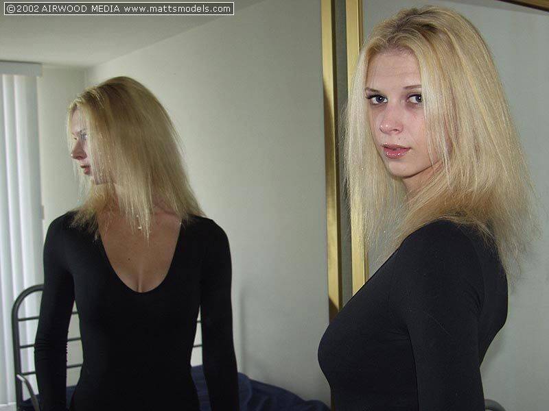 Tall blonde Brooke admires her ass in a mirror before getting naked on a bed - #13