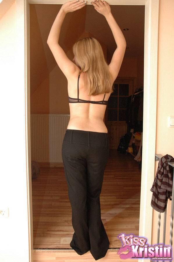 Blonde amateur Kiss Kristin goes topless in a doorway at home - #11