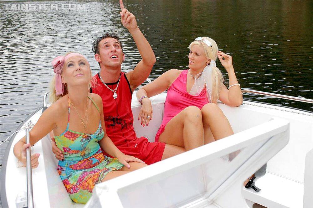 Clothed blondes hike up their dresses before being peed upon on a boat - #12