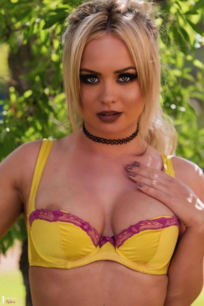 Gorgeous blonde Sara Louise releases her firm tits from a bra by a tree - #7