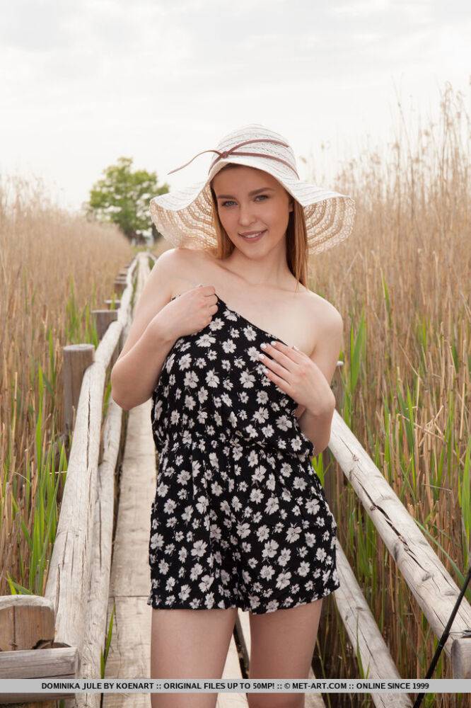 Cute teen Dominika Jule gets totally naked while fishing off of a boardwalk - #6