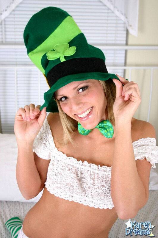 Young blonde Karen models white lingerie and a St Patty's Day hat on a bed - #2