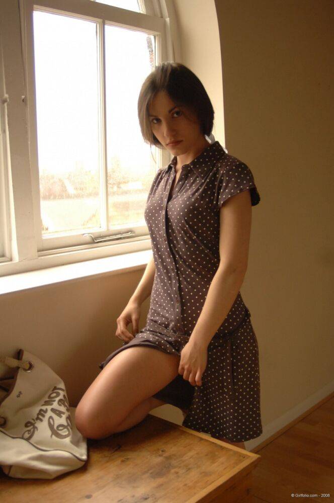 Solo girl slips off her dress and underthings in front of a window - #8