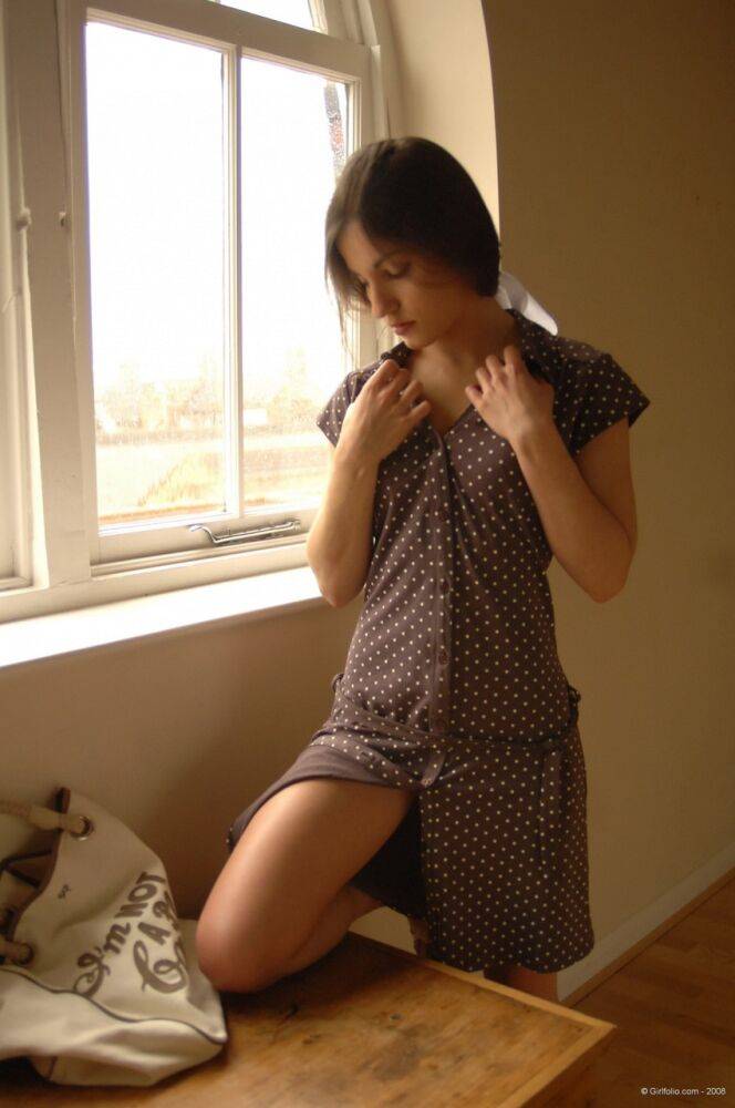 Solo girl slips off her dress and underthings in front of a window - #5