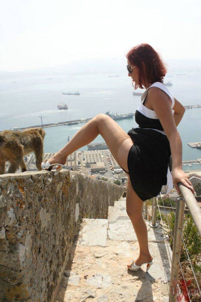 Solo girl flashes a no panty upskirt in nylons while on vacation in Gibraltar - #13