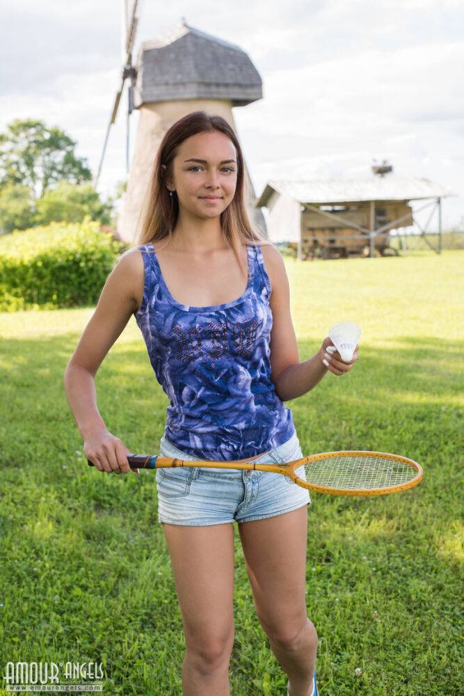 Cute teen Mary gets completely naked on a lawn after playing badminton - #16