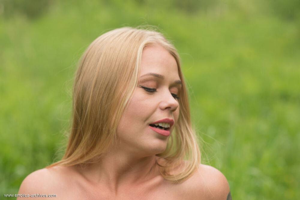 Natural blonde Sarika A shows her totally naked body amid lush grasses - #4