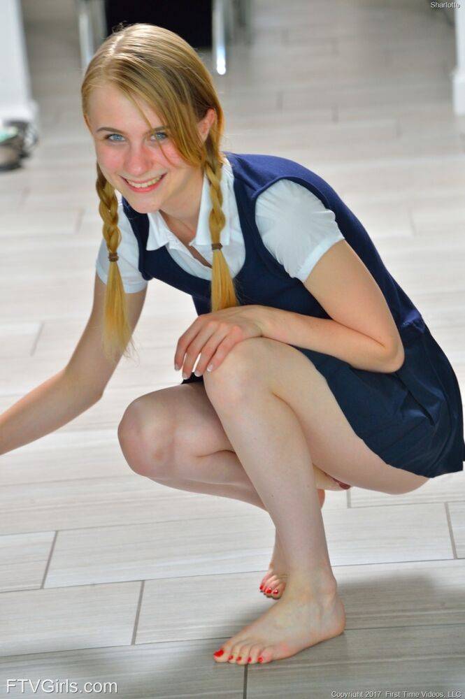 Tiny schoolgirl Sharlotte in uniform bends over for a naked upskirt outside - #2