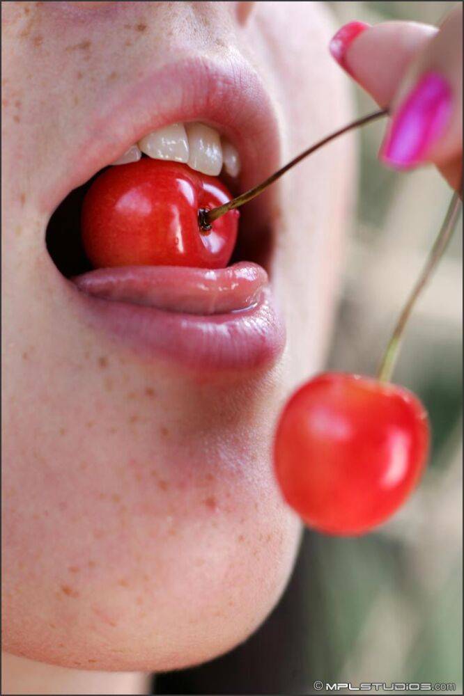 Totally naked teen eats cherries while lounging on a seaside hammock - #9