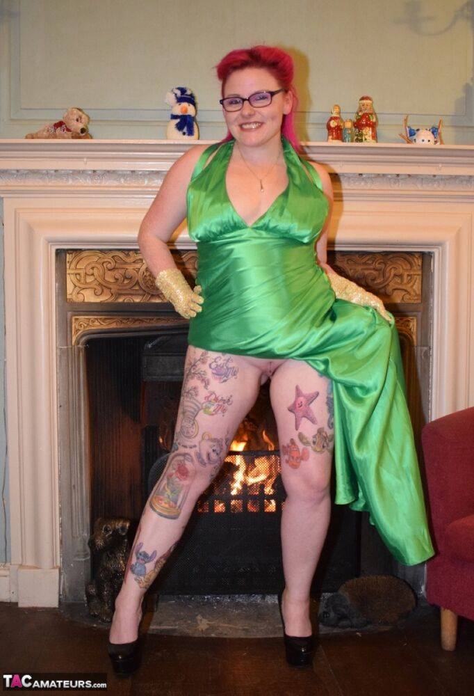 Tattooed amateur Mollie Foxxx exposes herself afore a fireplace in a dress - #2