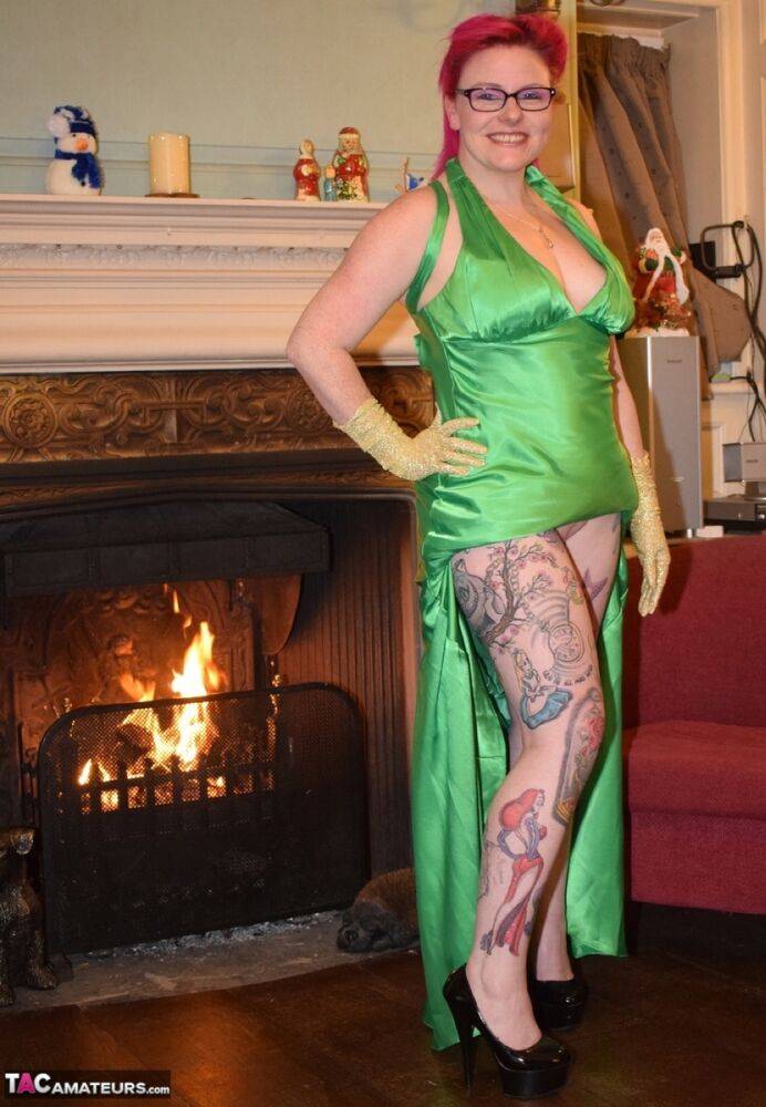 Tattooed amateur Mollie Foxxx exposes herself afore a fireplace in a dress - #10