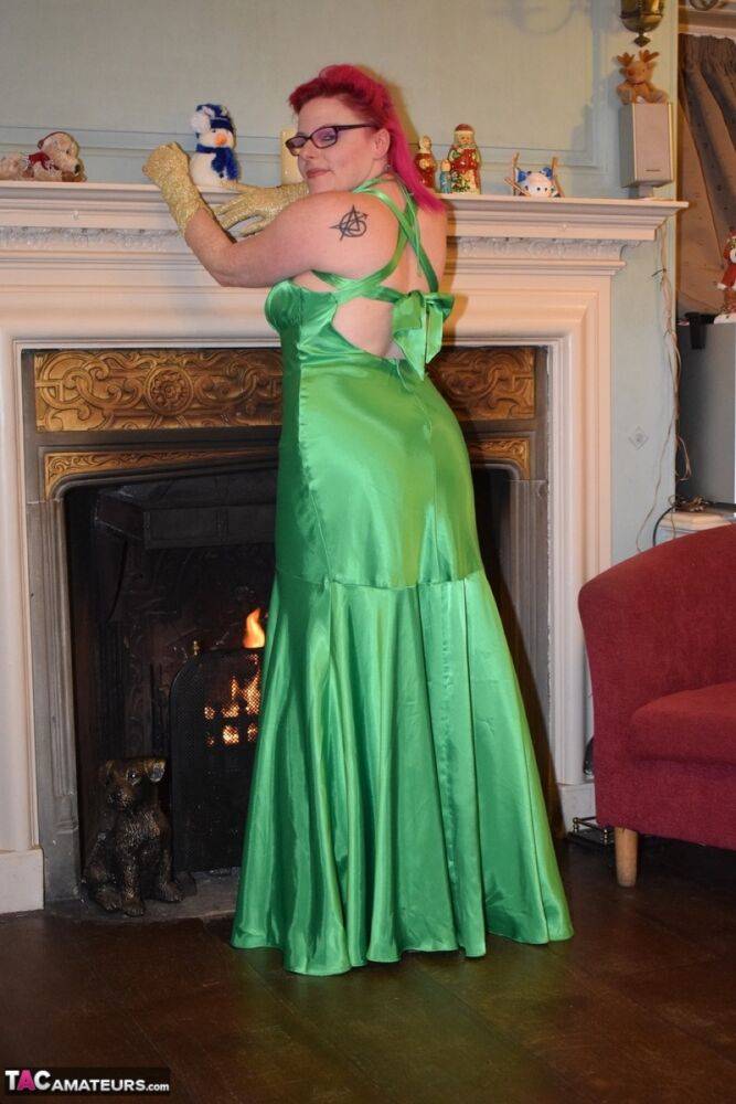 Tattooed amateur Mollie Foxxx exposes herself afore a fireplace in a dress - #15
