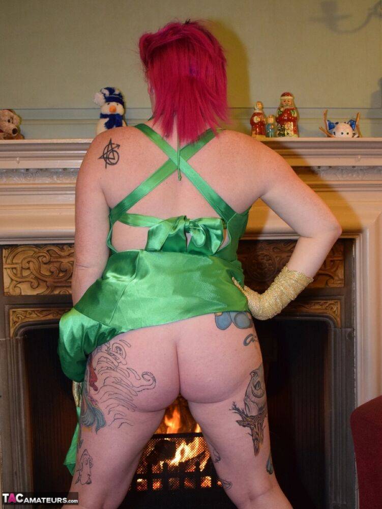 Tattooed amateur Mollie Foxxx exposes herself afore a fireplace in a dress - #14