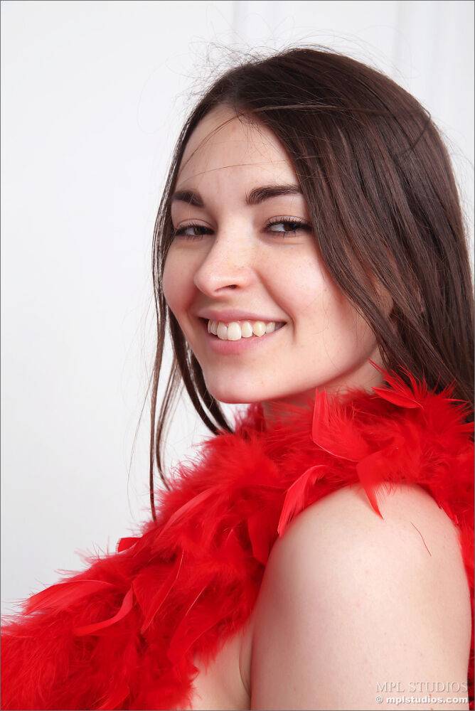 Pretty face brunette fingers her horny pussy wearing only a red boa - #8