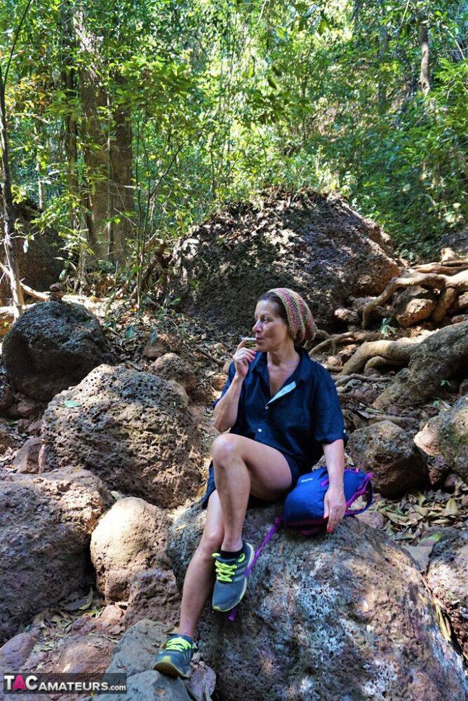 Mature amateur Diana Ananta sports a no panty upskirt while hiking in a forest - #9