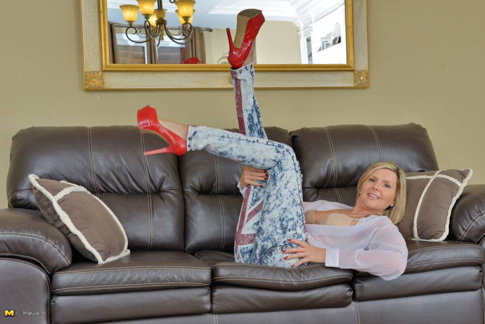 Older woman from Canada strips down her red pumps on a leather couch - #8