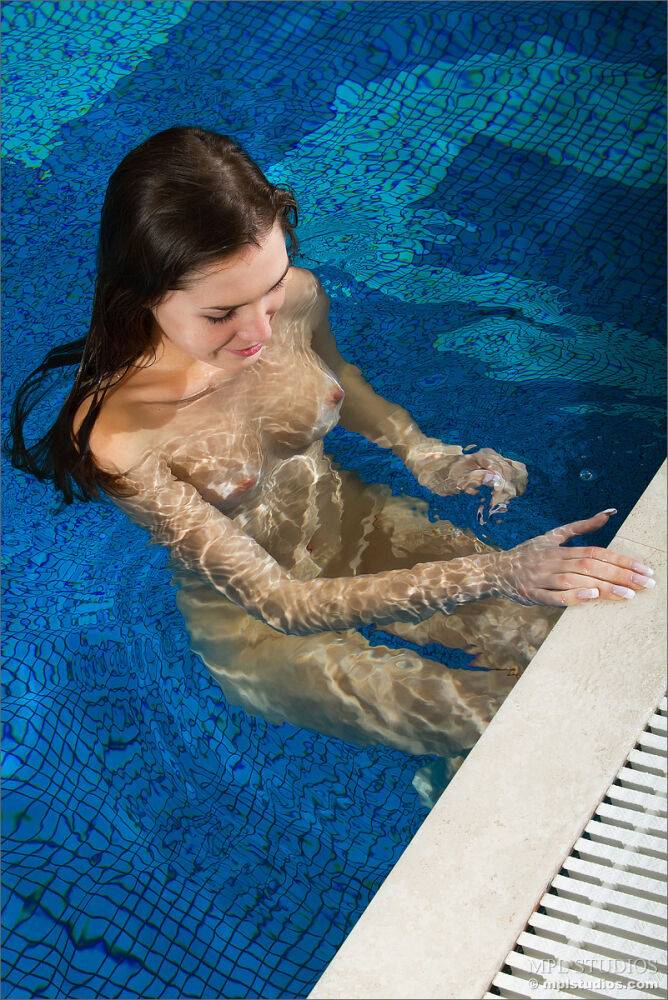 Hot brunette model swims nude in the pool and shows her naked pussy close up - #11