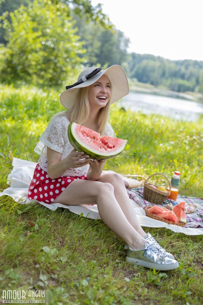 Cute teen Sophie gets totally naked while eating a watermelon in a meadow - #9