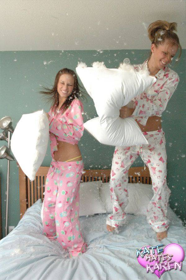 Teen lesbians cover their naked tits with feathers after a pillow fight - #11