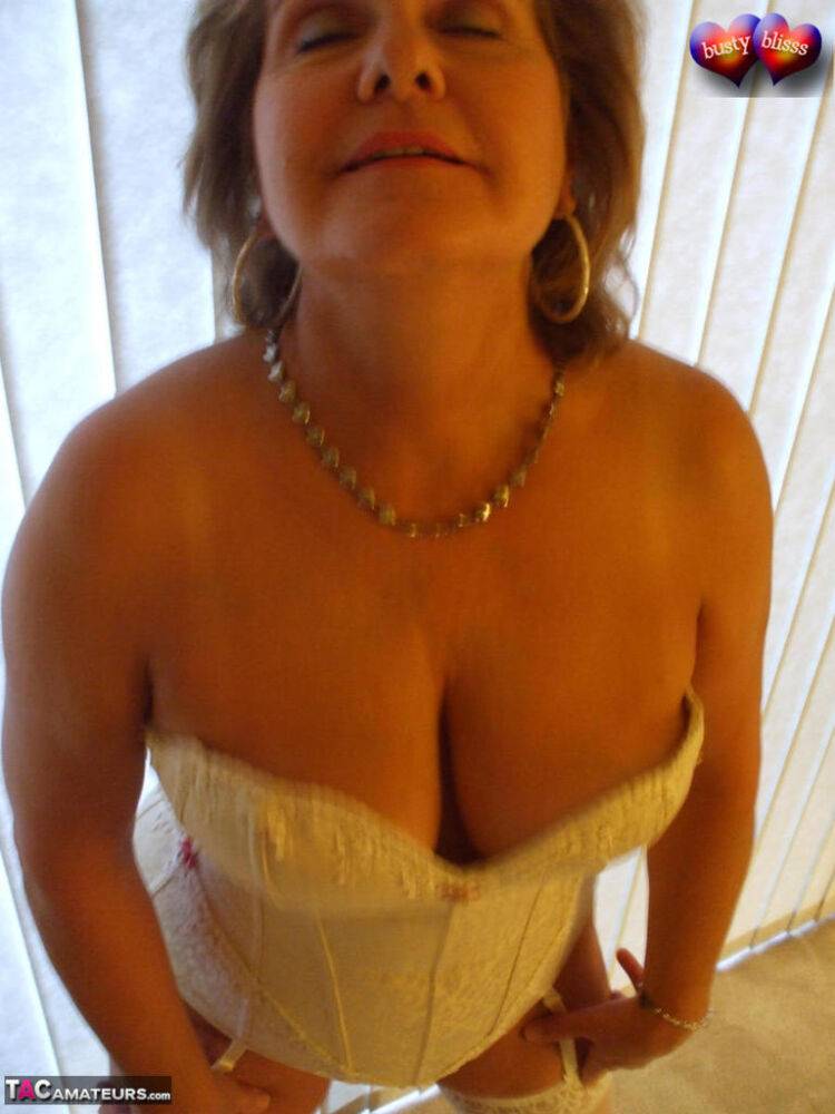 Mature woman models non nude in a corset and nylons with garters - #10