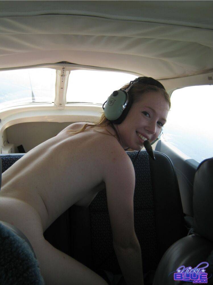 Natural redhead Nicki Blue gets totally naked aboard a small engine aircraft - #5