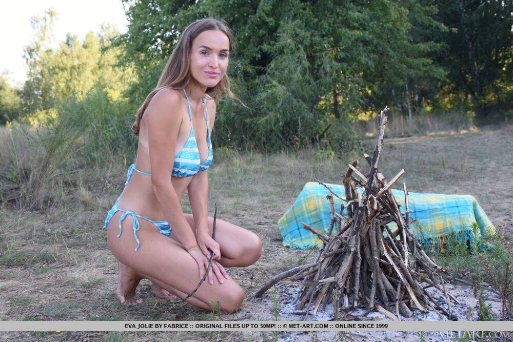 Teen solo girl Eva Jolie removes her bikini after jumping over a fire - #16