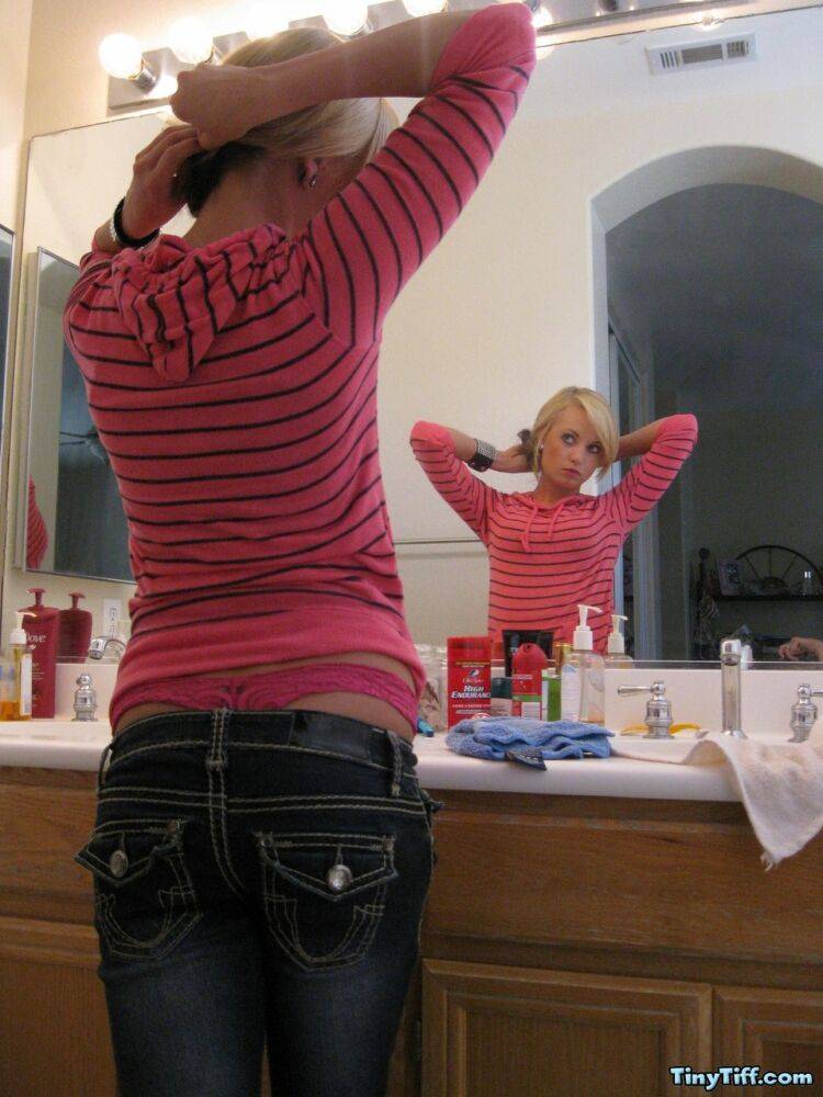 Blonde amateur Tiny Tiff sports a whale tail while doing her hair in a mirror - #16