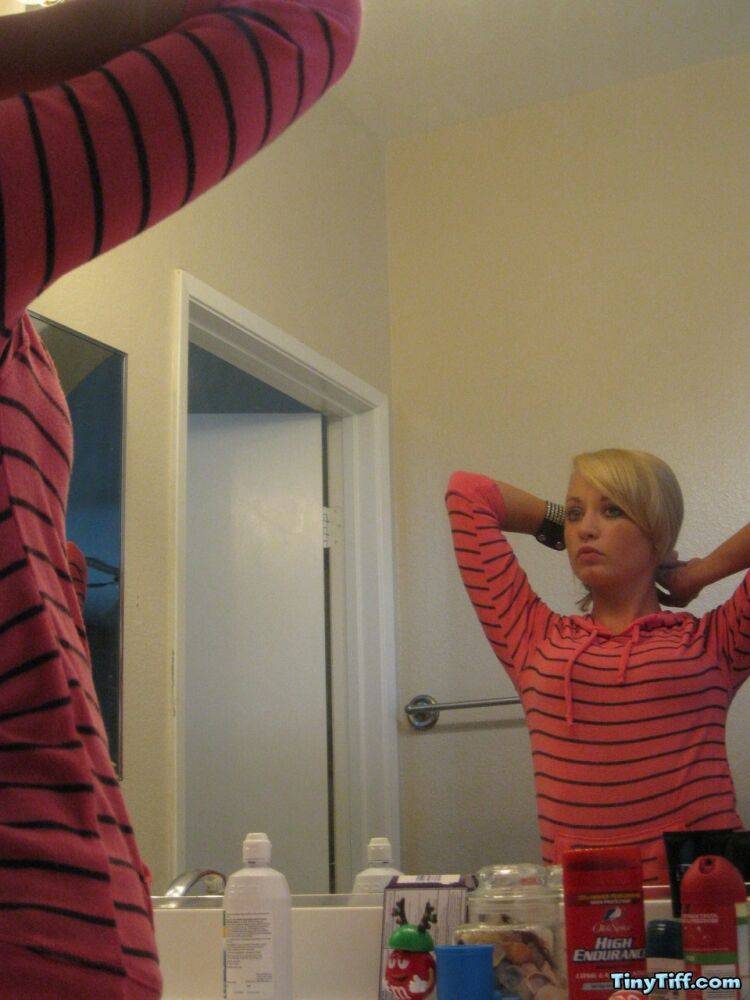 Blonde amateur Tiny Tiff sports a whale tail while doing her hair in a mirror - #1