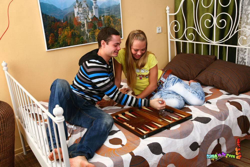 Young blonde and her boyfriend fuck after a game of backgammon on a bed - #5