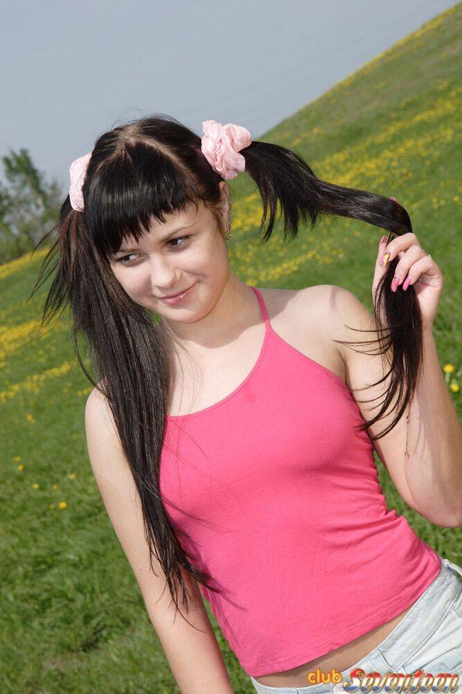 Cute teen wears her black hair in pigtails during PTM sex in a field - #1