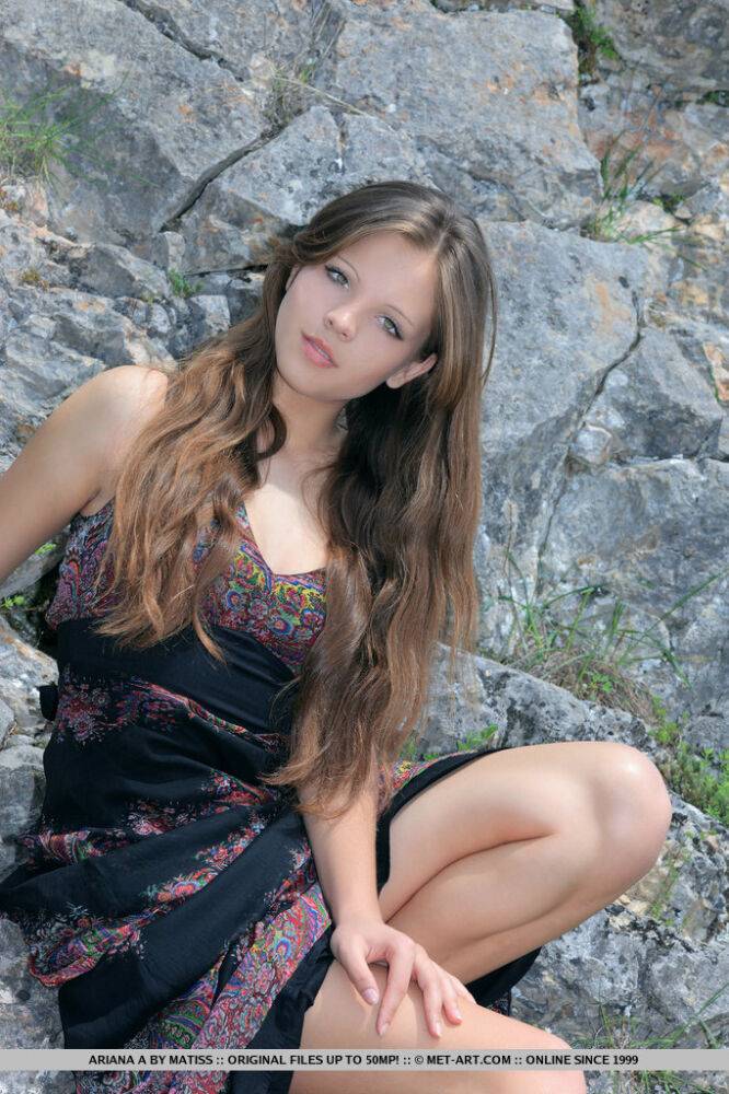 Beautiful teen Ariana A removes her long dress to model naked on a hillside - #12