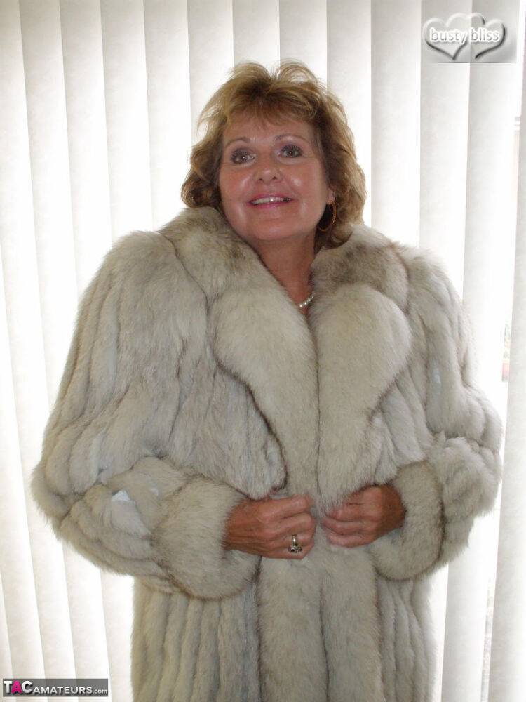 Mature amateur Busty Bliss exposes her tan lined tits while wearing a fur coat - #3