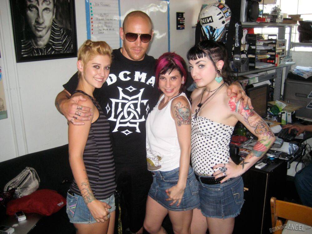 Clothed females with tattoos flash their butts while at a party - #6