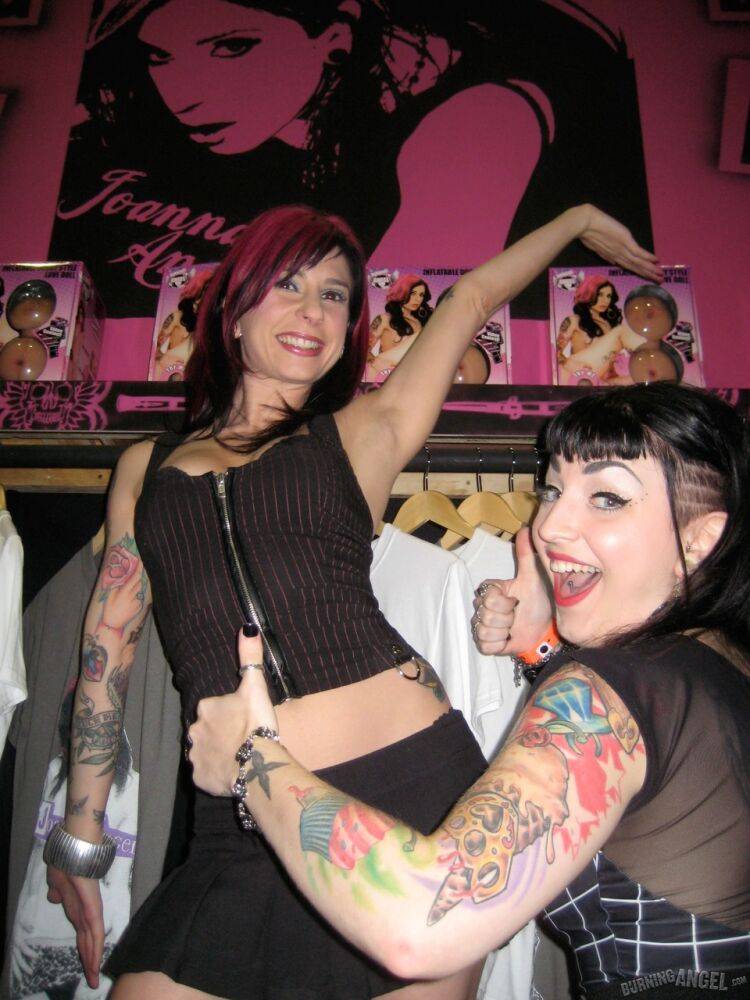 Clothed females with tattoos flash their butts while at a party - #10