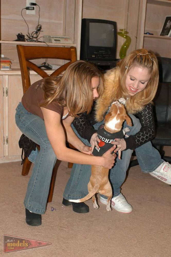 Clothed amateur Mandy T plays with a puppy before flashing a winning smile - #8