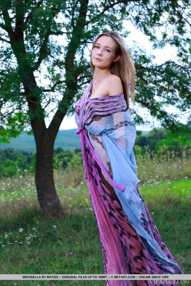 Tall young girl Mirabella displays her skinny body in a field - #15