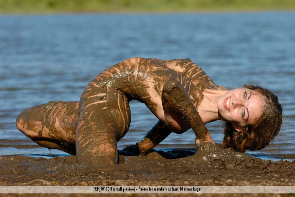 Pretty girl Katelin covers her flexible body in mud while at a lake - #7