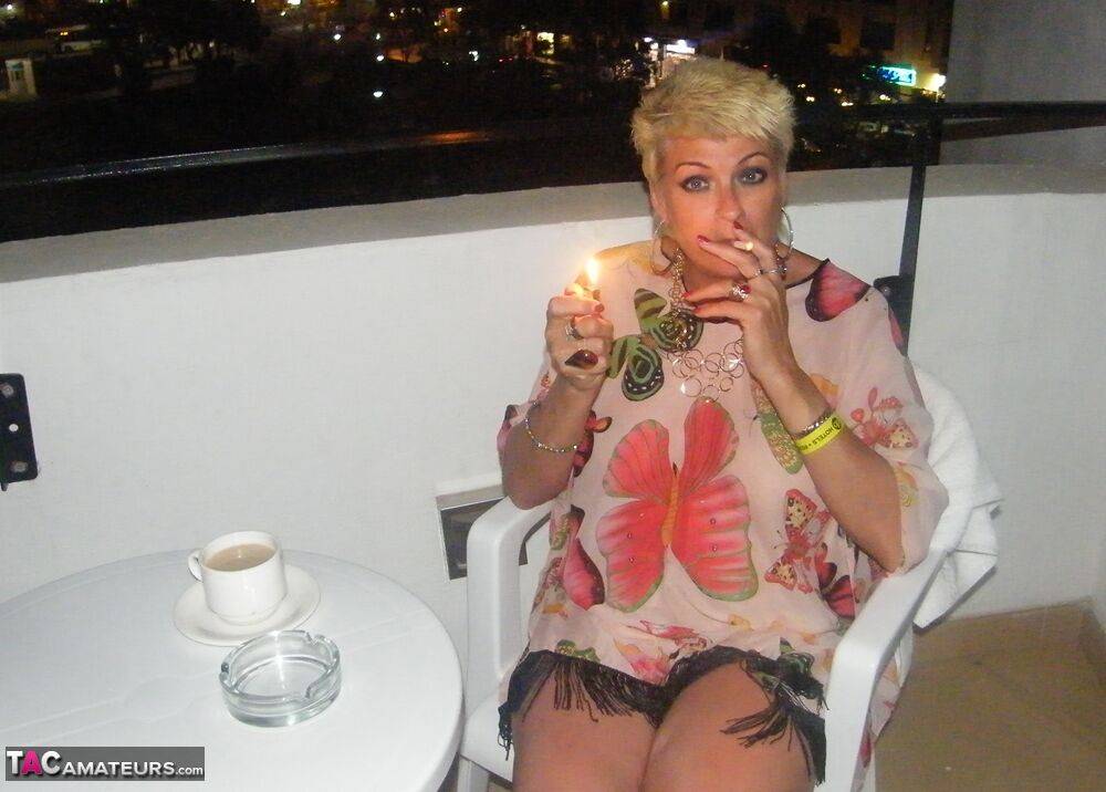 Sexy mature woman Dimonty gets naked after smoking a cigarette on balcony - #15